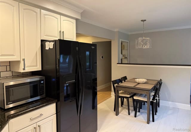 Kitchen with microwave nook beside the dining area