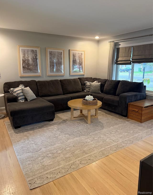 Living room with sectional sofa and neutral area rug