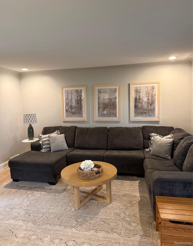Living room sectional with chaise and round coffee table