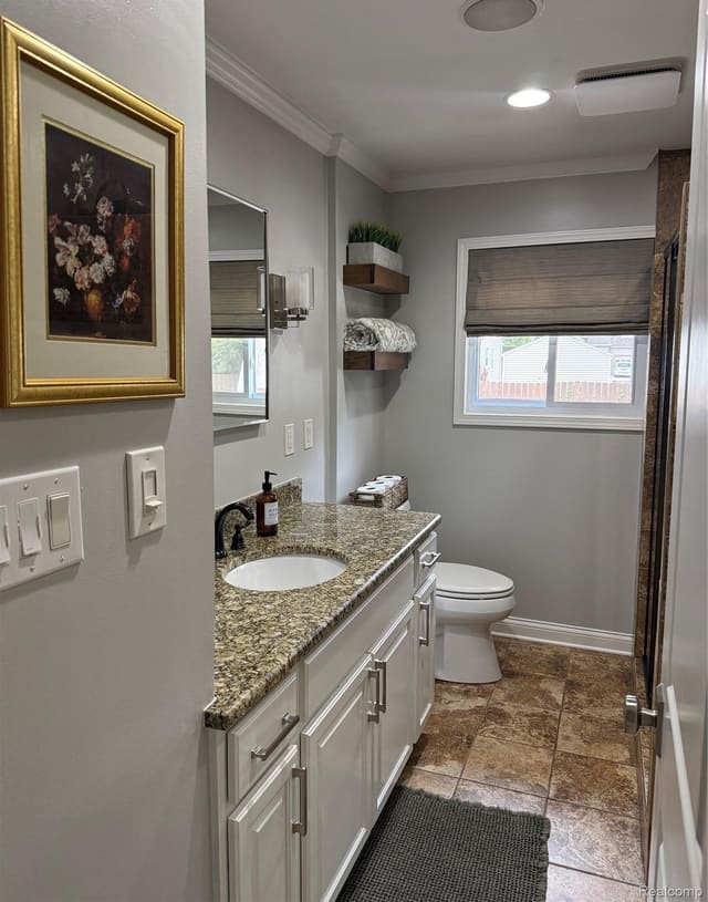 Updated full bathroom with granite-topped vanity