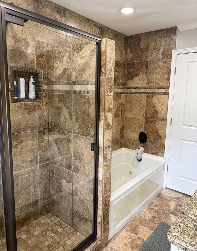 Tiled tub and shower with sliding glass door
