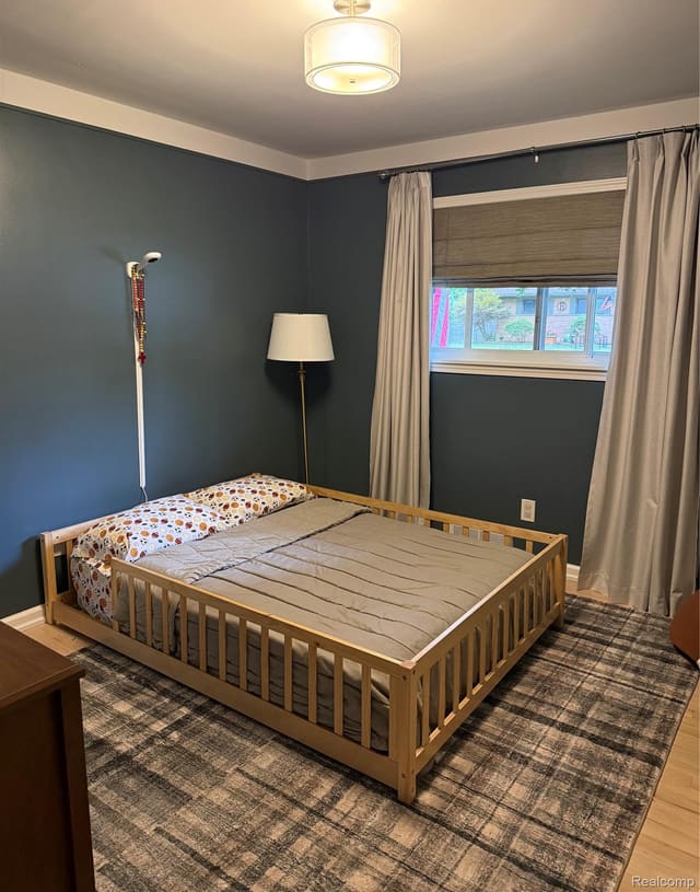 Second bedroom with deep teal accent walls