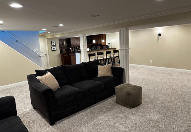 Basement lounge seating near the wet bar