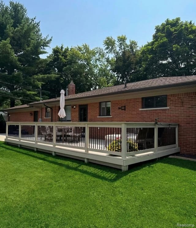 Backyard with expansive rear deck and mature trees